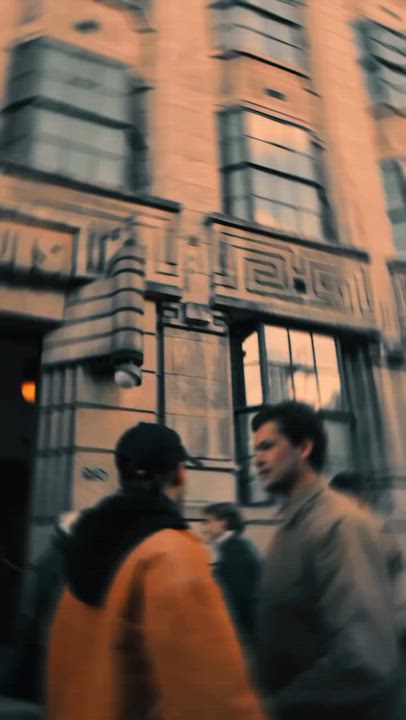 A cinematic street scene from a music video